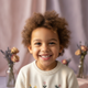 Portrait of a smiling child, approximately 5-7 years old, with a soft, natural background.